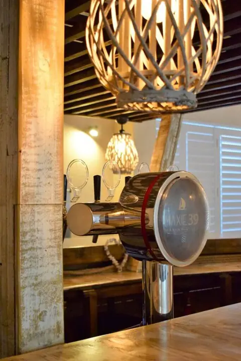 Woven pendant lamp above the boat-bar