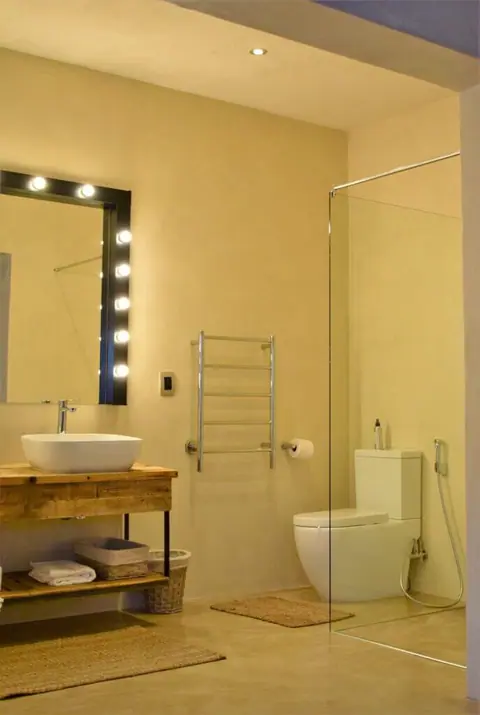 En-suite with a lit vanity mirror and walk-in shower